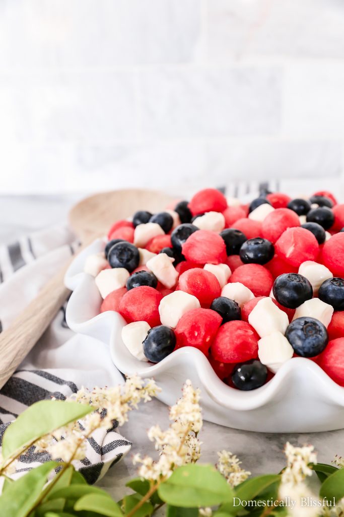 This Patriotic Fruit Caprese is a fun way to enjoy your favorite summer fruit and mini mozzarella balls on the 4th of July.
