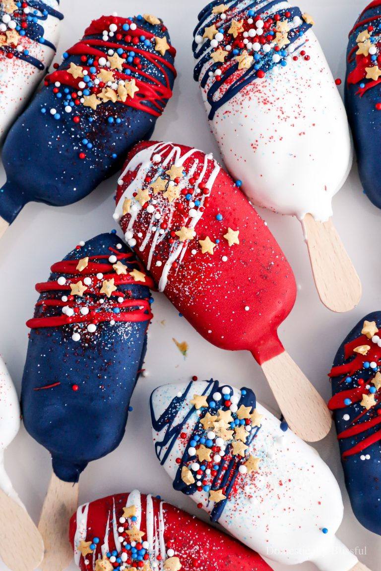 These 4th of July Ice Cream Bars are a quick Independence Day dessert hack using store-bought ice cream bars and topped with red, white, and blue candy melts and sprinkles.