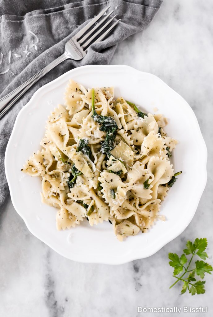 This Spinach Artichoke Pasta is an easy dinner recipe that is quick enough for a weeknight, yet so full of delicious flavors it is perfect for a dinner party. 