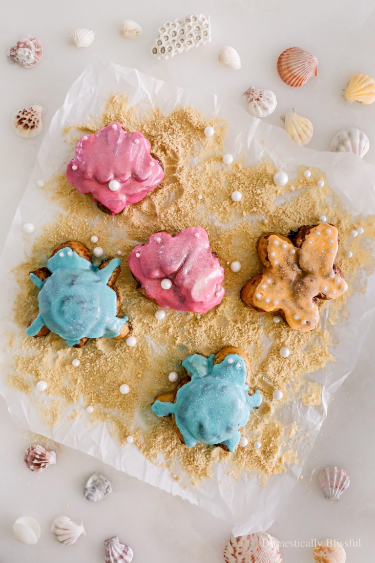 These DIY Beach Cinnamon Rolls are so fun to make for your family or a beach party this summer with cinnamon roll-shaped seashells, turtles, and starfish!