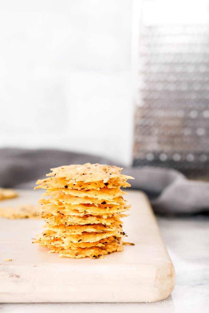 A two-ingredient recipe for Black Pepper Parmesan Crisps that are perfect for topping soup or salad or eating with dip!