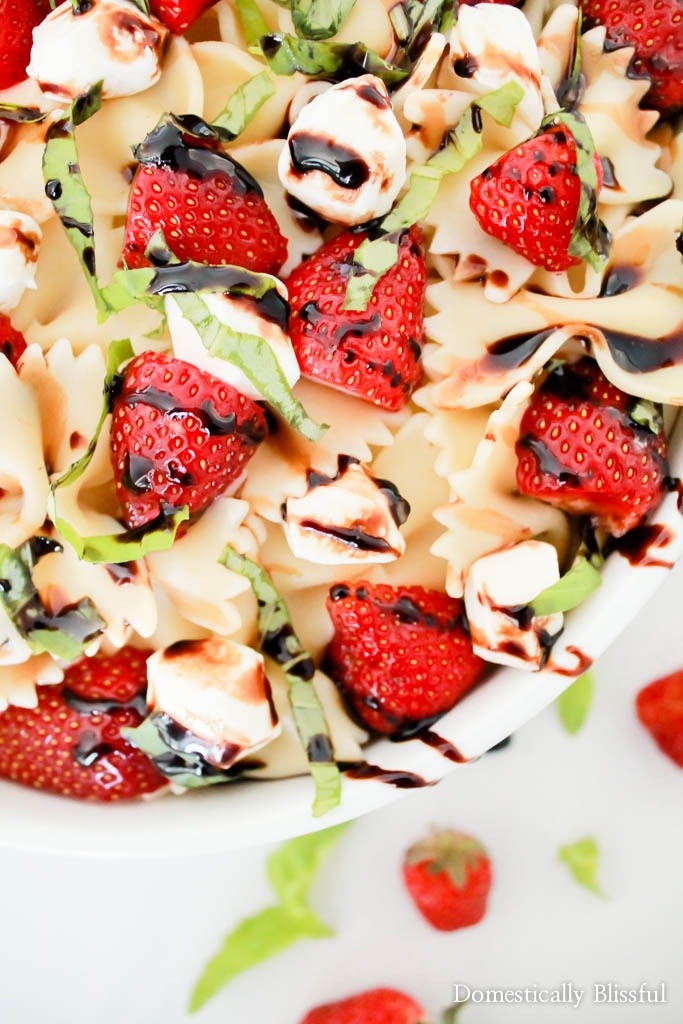 Strawberry Caprese Pasta Salad is overflowing with fresh flavor & is the perfect addition to any summer meal!