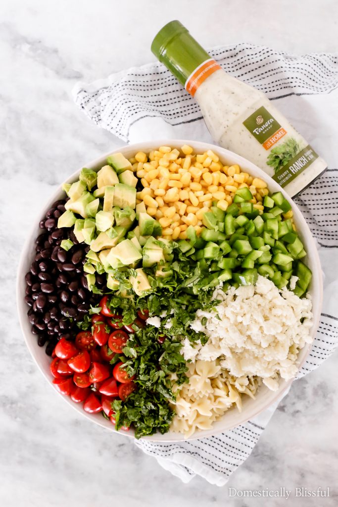 This Mexican Pasta Salad is a colorful vegetarian pasta recipe filled with fresh vegetables and topped with Panera Creamy Buttermilk Ranch+Dip at Publix.