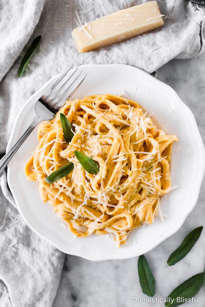 This Creamy Pumpkin Alfredo Fettuccine is a great use for leftover pure pumpkin and is a creamy fall dinner recipe your whole family will love!