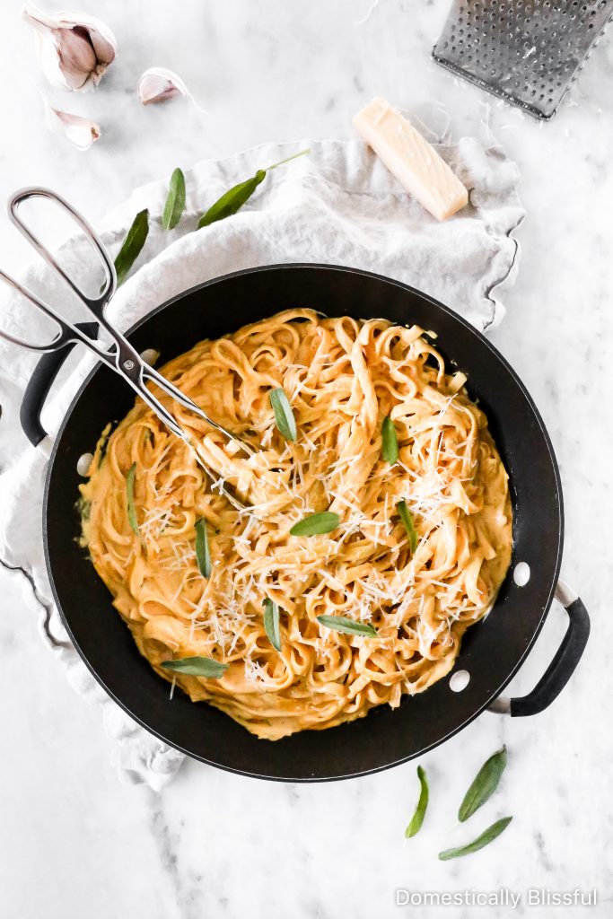 This Creamy Pumpkin Alfredo Fettuccine is a great use for leftover pure pumpkin and is a creamy fall dinner recipe your whole family will love!