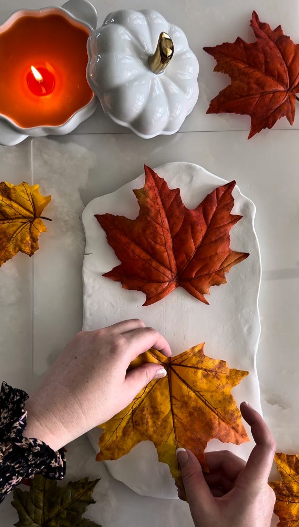 This DIY Clay Leaf Napkin Holder is a fun fall craft that makes a great gift and beautiful autumn decor for your kitchen.