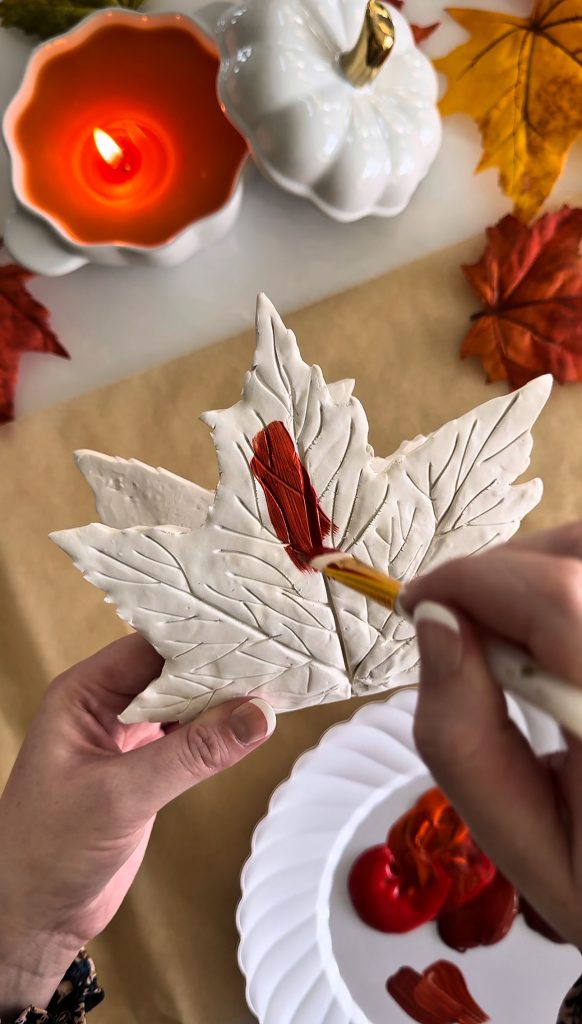 This DIY Clay Leaf Napkin Holder is a fun fall craft that makes a great gift and beautiful autumn decor for your kitchen.