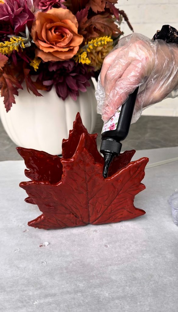 This DIY Clay Leaf Napkin Holder is a fun fall craft that makes a great gift and beautiful autumn decor for your kitchen.