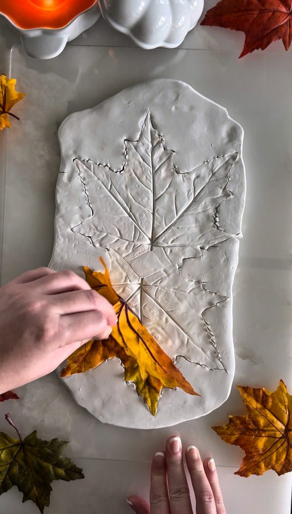 This DIY Clay Leaf Napkin Holder is a fun fall craft that makes a great gift and beautiful autumn decor for your kitchen.