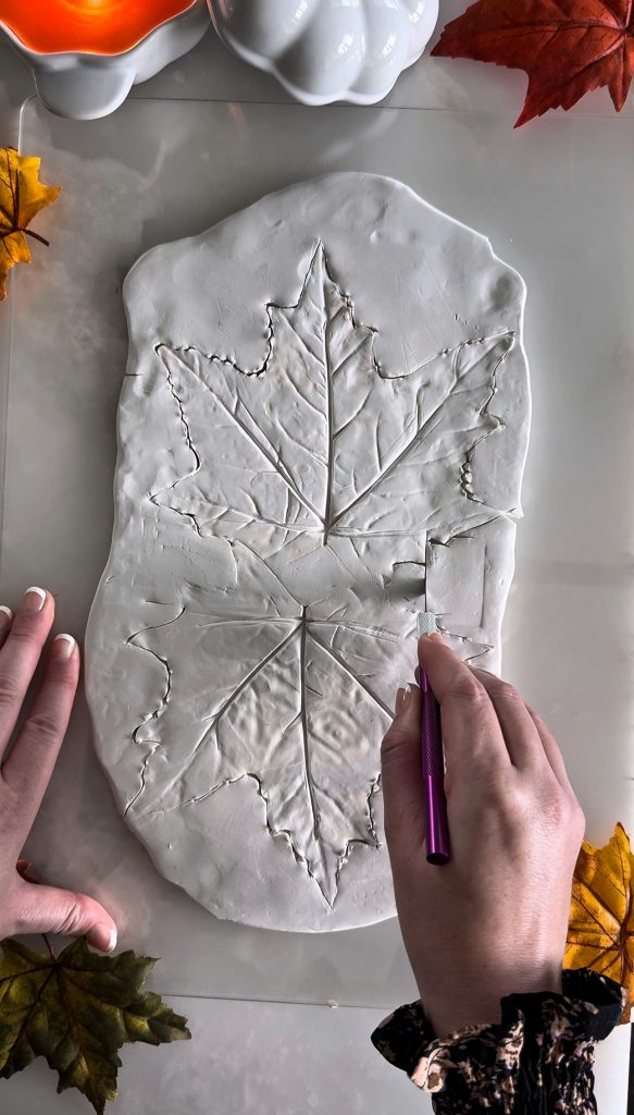 This DIY Clay Leaf Napkin Holder is a fun fall craft that makes a great gift and beautiful autumn decor for your kitchen.