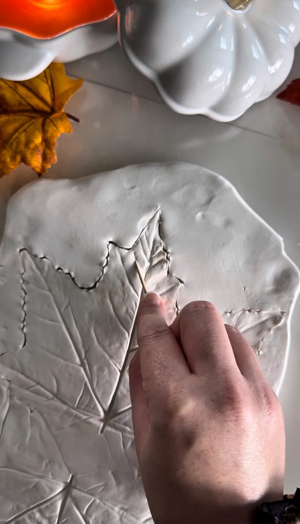 This DIY Clay Leaf Napkin Holder is a fun fall craft that makes a great gift and beautiful autumn decor for your kitchen.