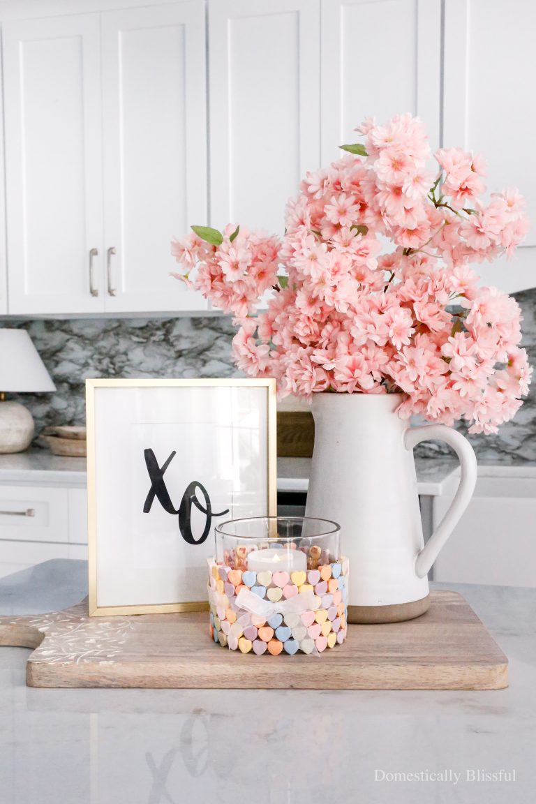 This DIY Conversation Heart Hurricane Candle Holder is sealed so you can use it year after year to decorate for Valentine's Day.