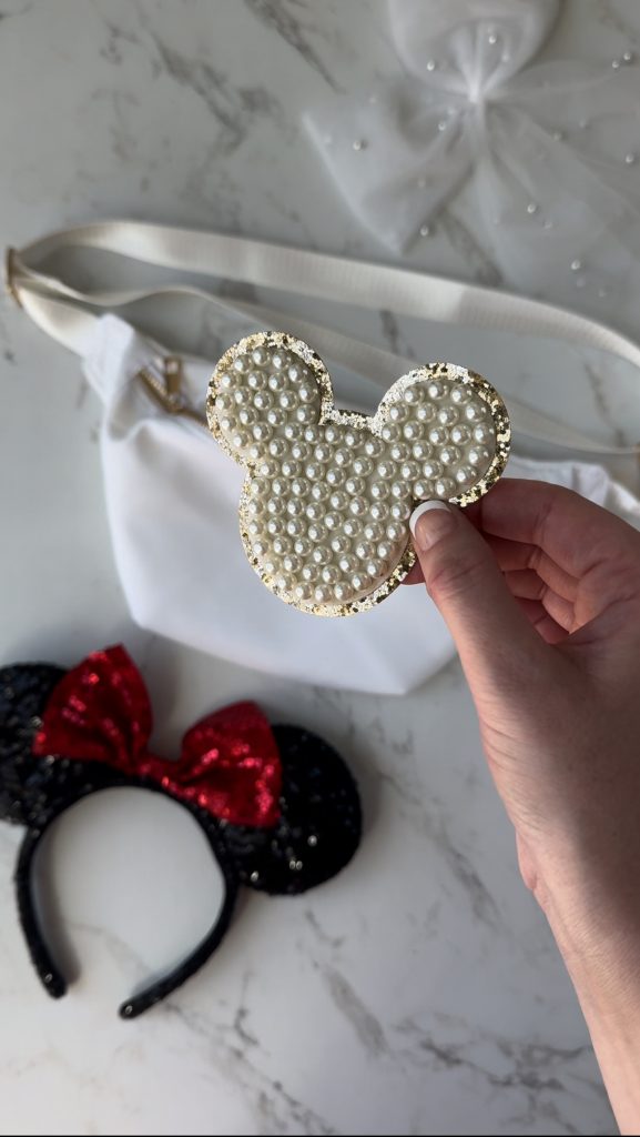 A DIY Disney Bag with a pearl Mickey Mouse patch to take on your next Disney World Vacation.