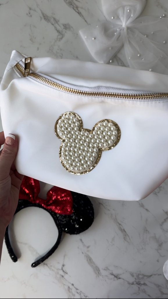 A DIY Disney Bag with a pearl Mickey Mouse patch to take on your next Disney World Vacation.