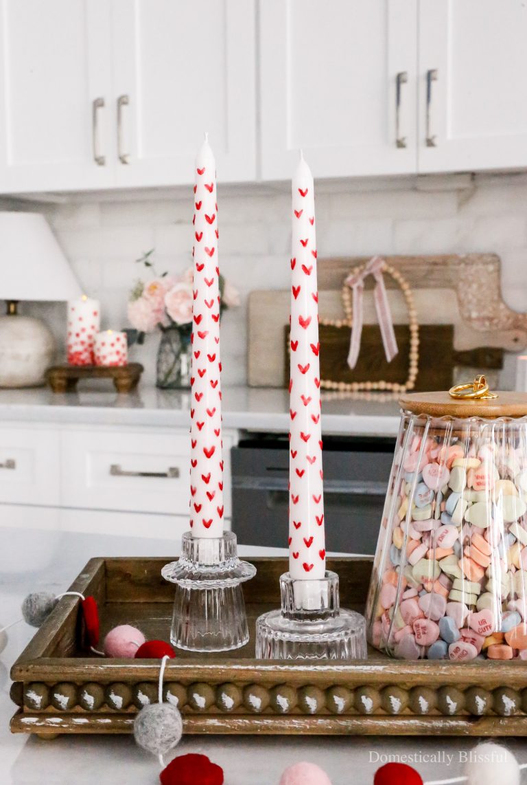 These DIY Painted Heart Candles are so fun and easy to create and would be so fun to make at a girl's night or Galentine's Day party.