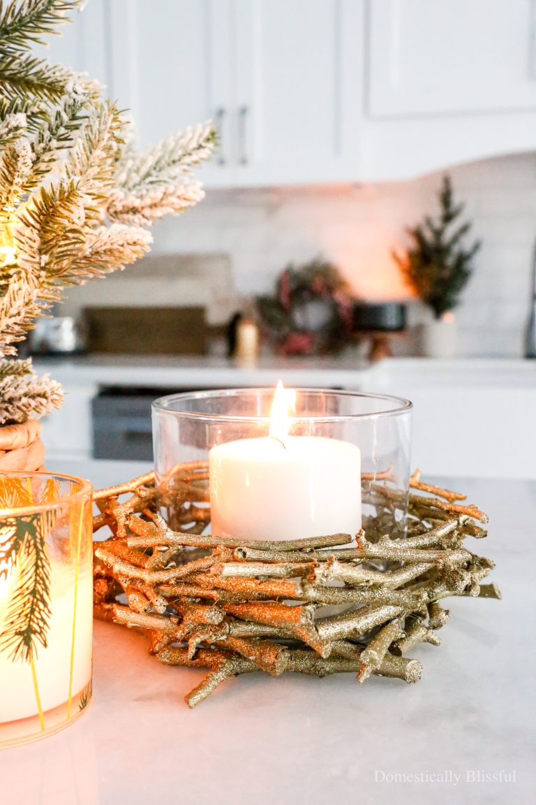This DIY Sparkly Stick Candle Holder is beautiful for both Christmas and New Year's Eve decor.