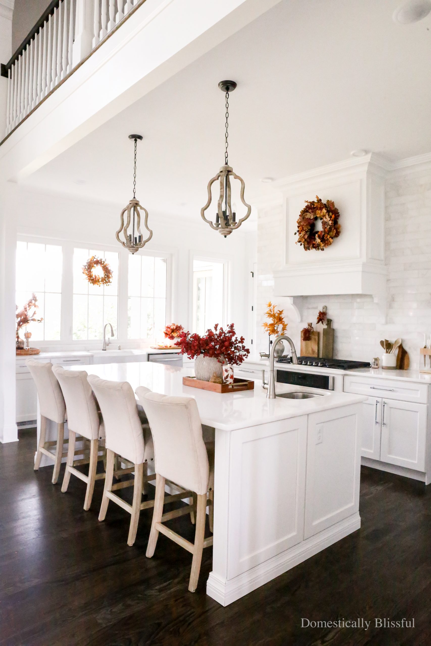 Simple Fall Kitchen Decor with moody fall colors in an all white kitchen.