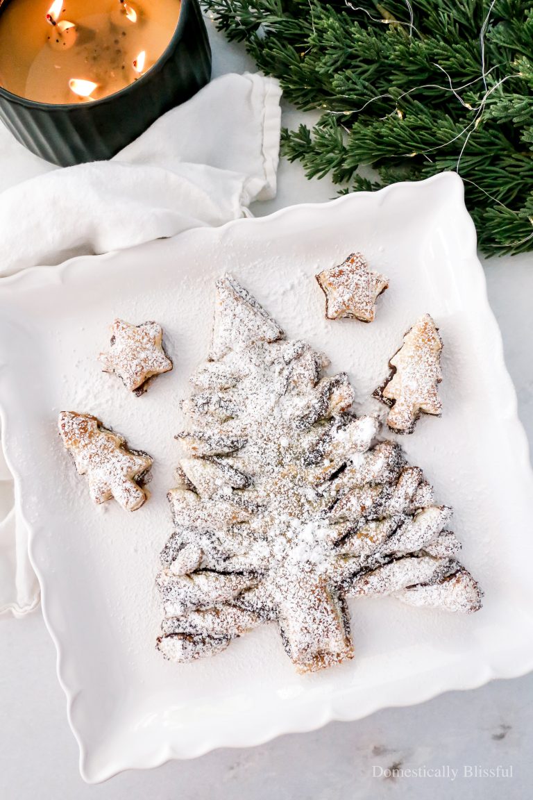 This Fruit Spread Nutella Puff Pastry Christmas Tree is filled with Nutella and strawberry fruit spread for a deliciously sweet Christmas treat.