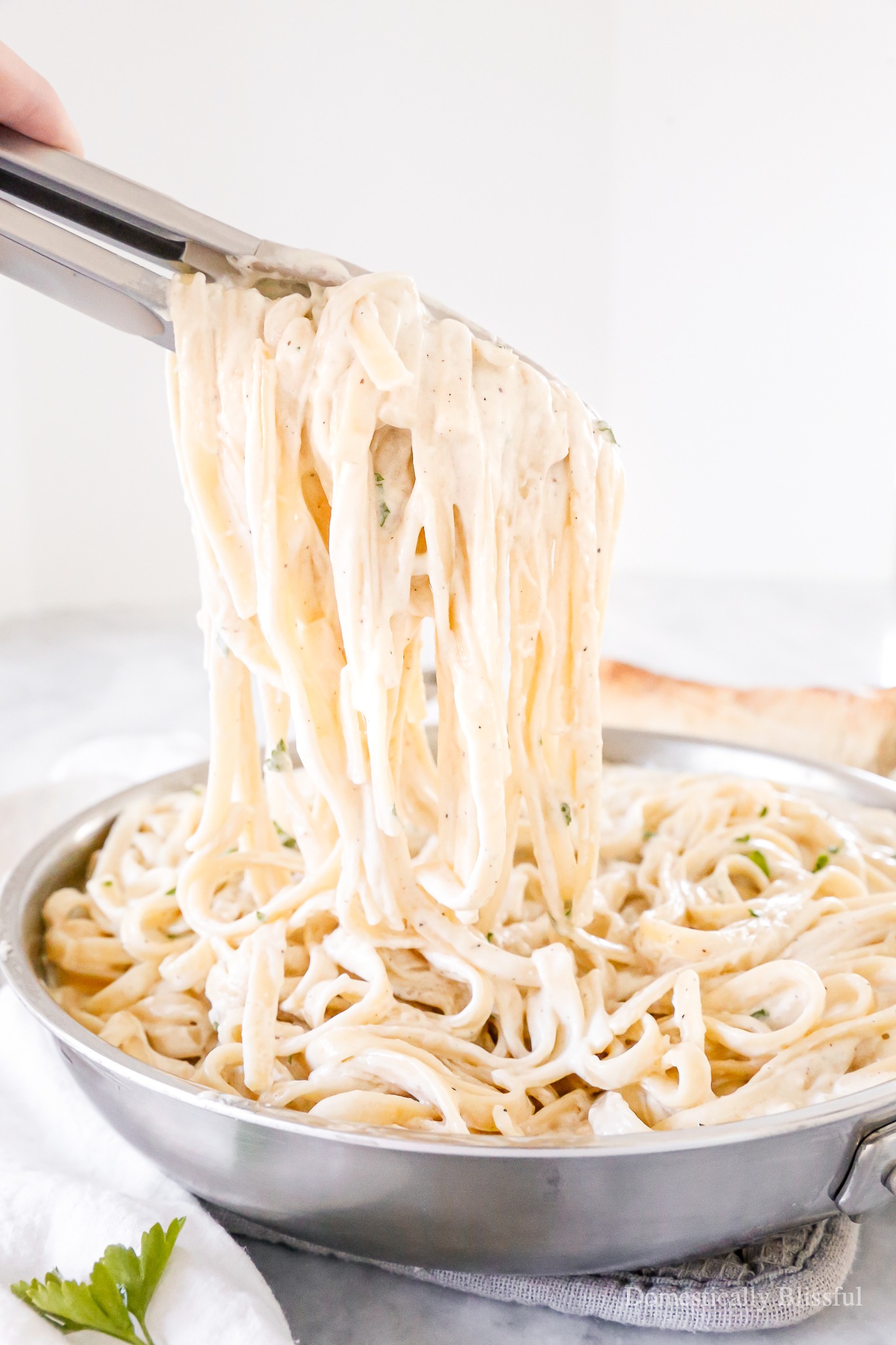 This homemade Creamy Alfredo Sauce is our family's favorite and has a secret ingredient you may not expect!