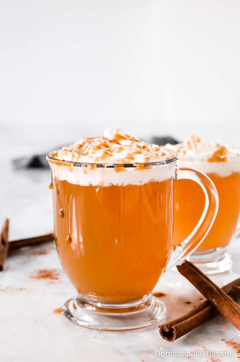 This Hot Caramel Apple Spice drink is made with fresh apple flavor, caramel sauce, a homemade cinnamon simple syrup, and topped with whipped cream and caramel sauce.