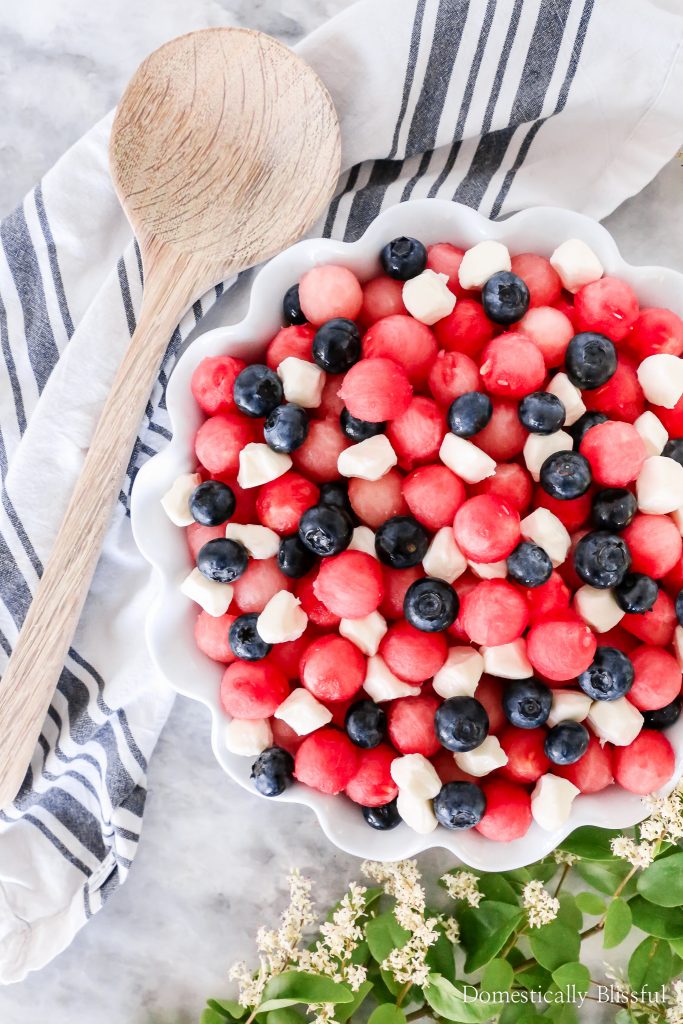 This Patriotic Fruit Caprese is a fun way to enjoy your favorite summer fruit and mini mozzarella balls on the 4th of July.