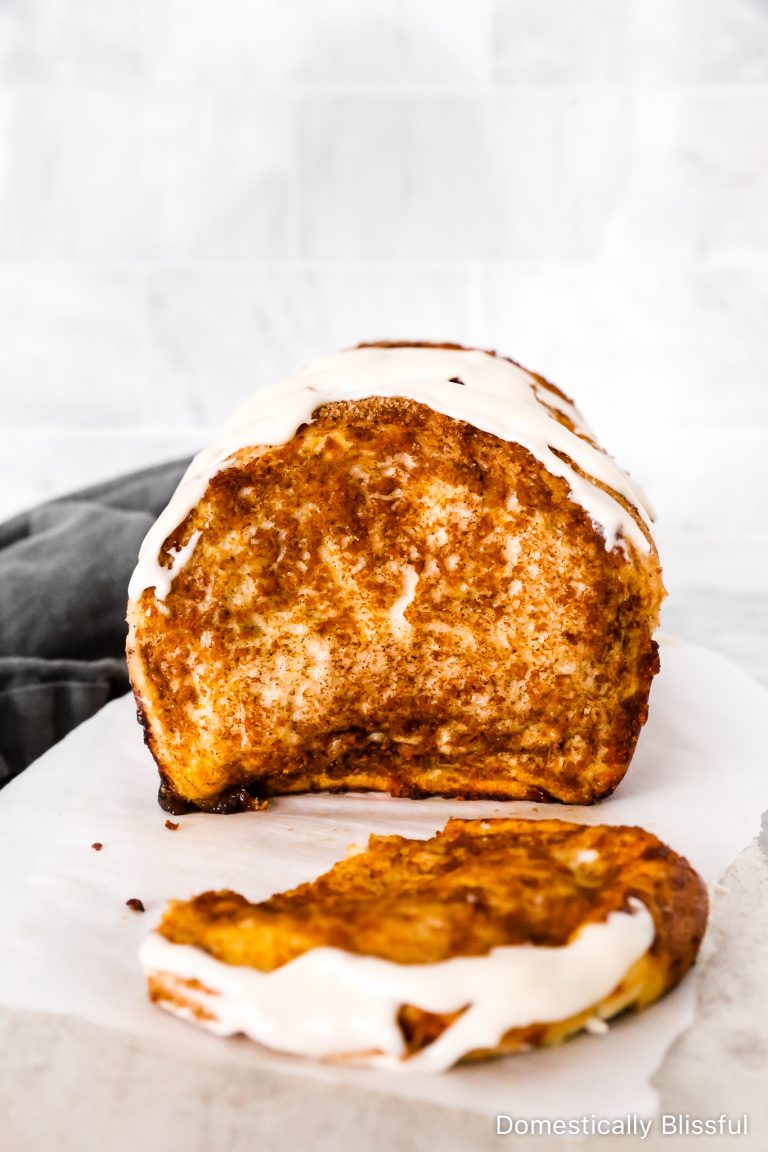 This Pull-Apart Pumpkin Spice Bread tastes like fall and is filled with pumpkin spice and topped with homemade cream cheese frosting.