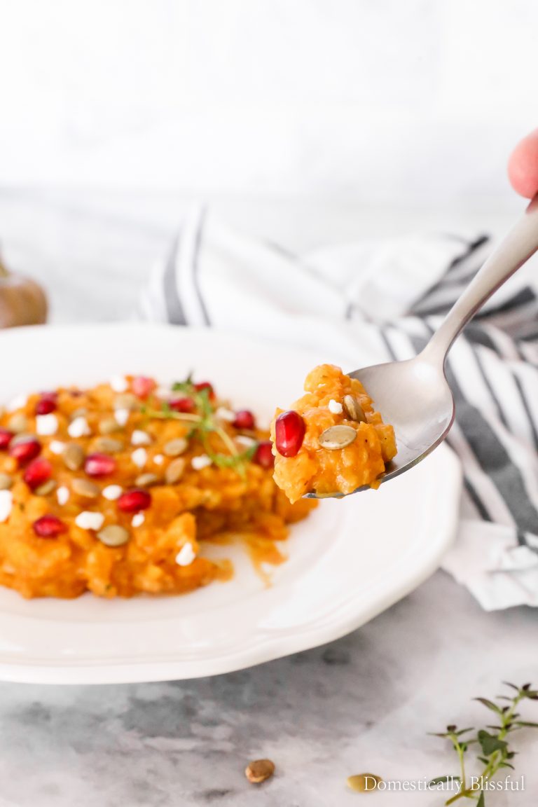 This Goat Cheese Pumpkin Risotto is topped with pomegranate seeds, fresh thyme, pumpkin seeds, and crumbled goat cheese for an extra special fall dinner.