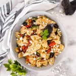 This Quick Mediterranean Pasta can be made in 15 minutes and is filled with a variety of colorful ingredients for a fun vegetarian dinner!