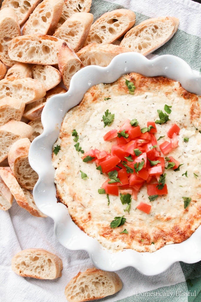 This Smoked Mozzarella Dip is filled with creamy flavors & is the perfect warm appetizer for any party or family gathering!