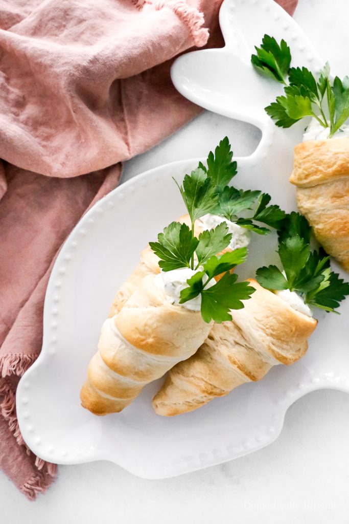 These Stuffed Crescent Roll Carrots are filled with Boursin, cream cheese, fresh parsley, and a squeeze of lemon. It is the perfect savory treat for an Easter brunch or spring party.