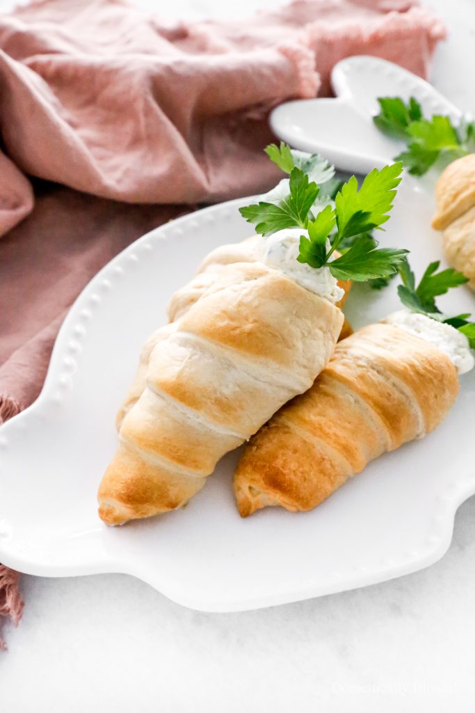 These Stuffed Crescent Roll Carrots are filled with Boursin, cream cheese, fresh parsley, and a squeeze of lemon. It is the perfect savory treat for an Easter brunch or spring party.