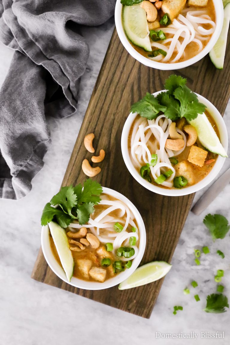 This Thai Tofu Noodle Soup is a vegetarian soup filled with noodles, tofu, and fresh vegetables and is topped with cashews, cilantro, chives, and fresh-squeezed lime!