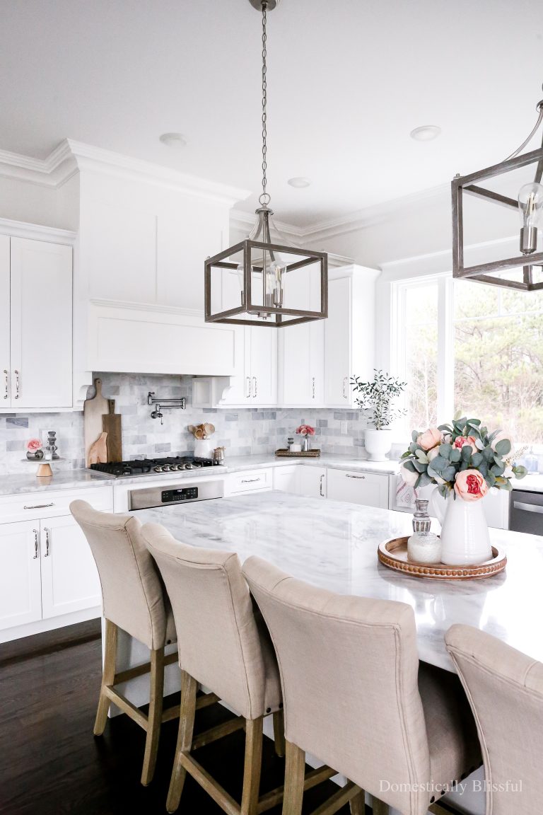 Simple Valentine's Day Kitchen Decor with pink flowers, hand towel, and candles.