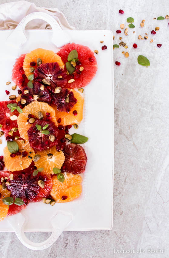 Enjoy your vitamin c this season through this beautiful & tasty citrus fruit salad garnished with pomegranate seeds, pistachios, mint, & a drizzle of honey!