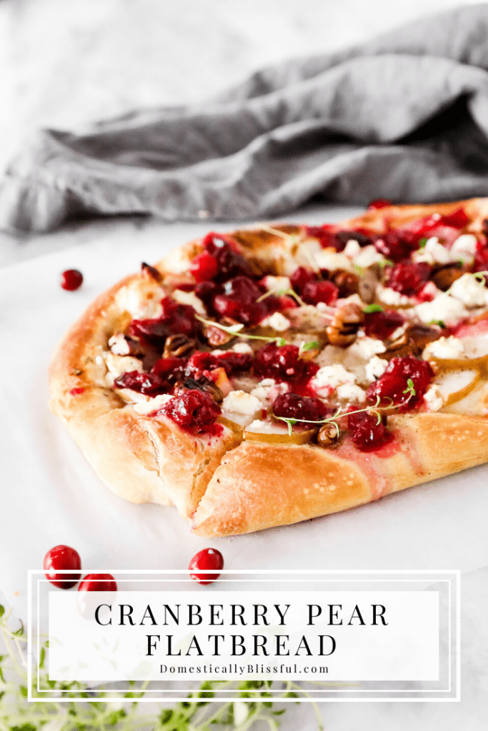 This Cranberry Pear Flatbread is topped with goat cheese, fresh pear, cranberry sauce, and pecans, making it a delicious Christmas appetizer or Thanksgiving leftover recipe.