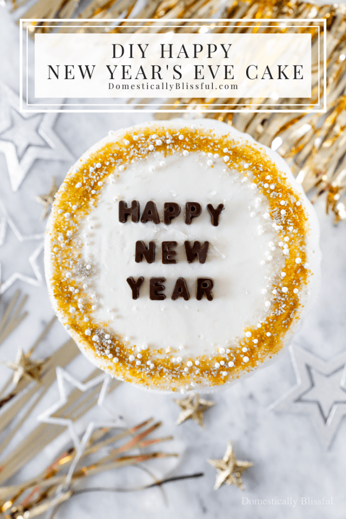 A quick and easy DIY Happy New Year's Eve Cake using a store-bought cake and redecorating it with gold, silver, and white sprinkles and chocolate letters.