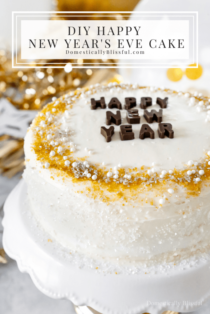 A quick and easy DIY Happy New Year's Eve Cake using a store-bought cake and redecorating it with gold, silver, and white sprinkles and chocolate letters.