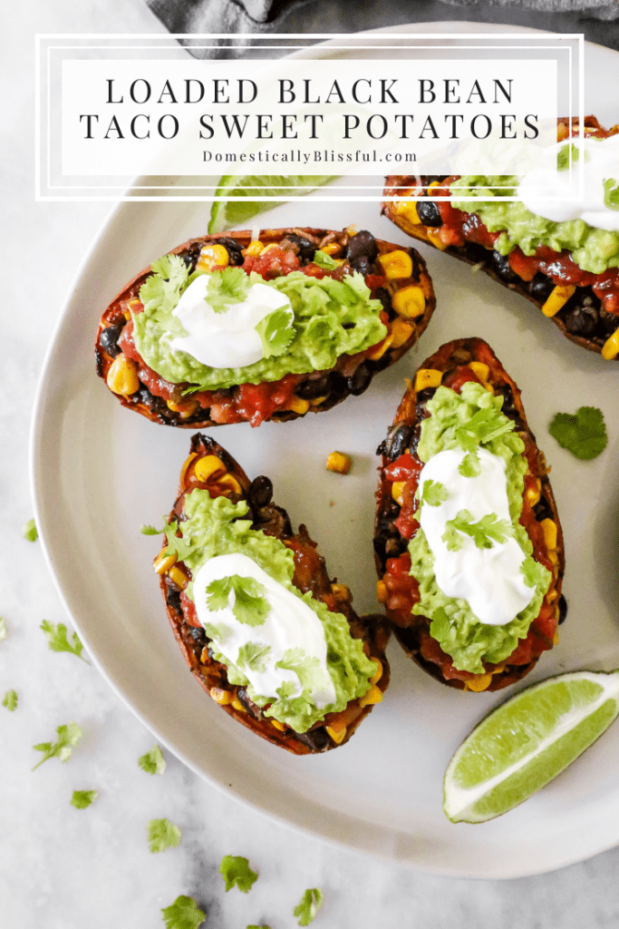 These Loaded Black Bean Taco Sweet Potatoes are covered in seasoned black beans and corn and topped with cheese, sour cream, salsa, guacamole, cilantro, and a squeeze of lime.